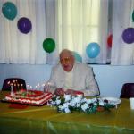 Arnold with cake at church dinner